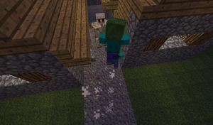 Iron Golem backing off a village during a siege.png